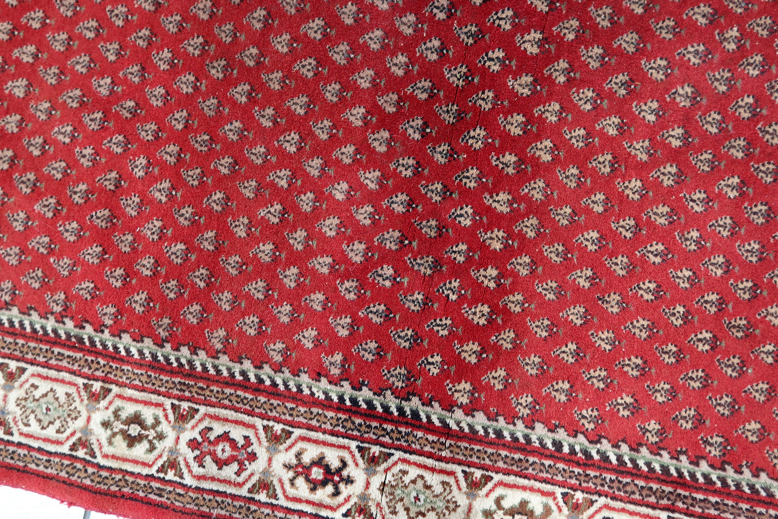 Handmade vintage Indian Seraband rug in red color and all-over design. The rug has been made in the end of 20th century. It is in original good condition.