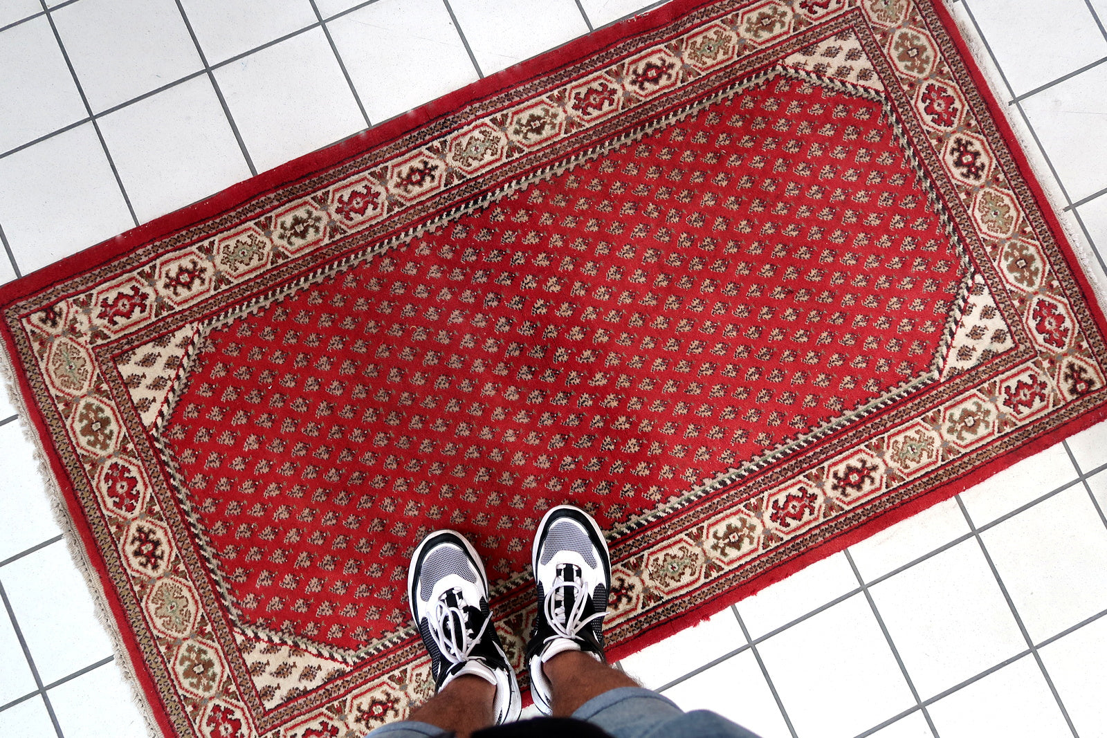 Handmade vintage Indian Seraband rug in red color and all-over design. The rug has been made in the end of 20th century. It is in original good condition.
