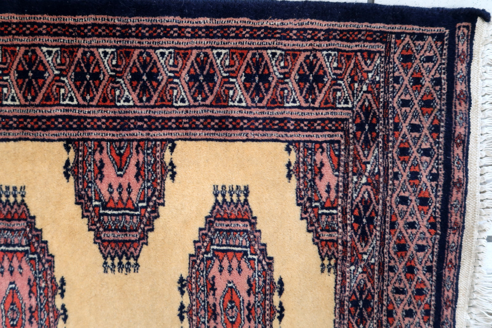 Handmade vintage Uzbek Bukhara narrow runner in yellow wool. The rug has traditional design. It is from the end of 20th century, in original good condition.