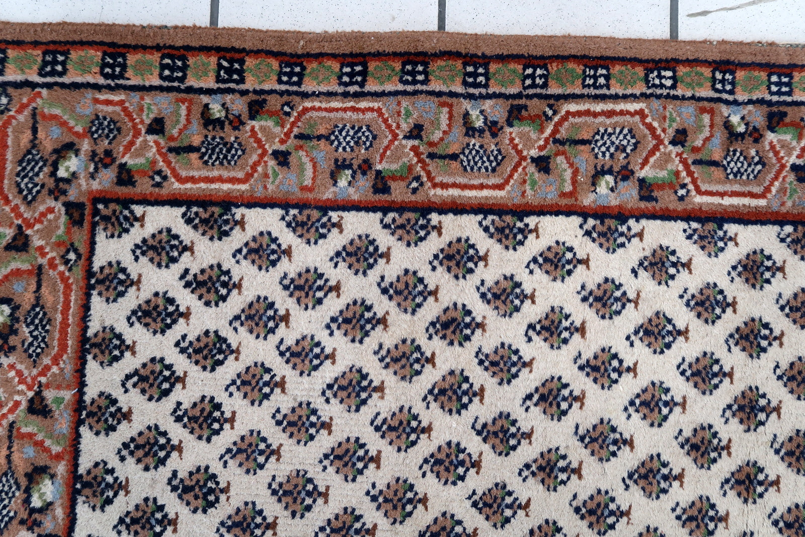 Handmade vintage Indian Seraband rug in white color and all-over design. The rug has been made in the end of 20th century. It is in original good condition.