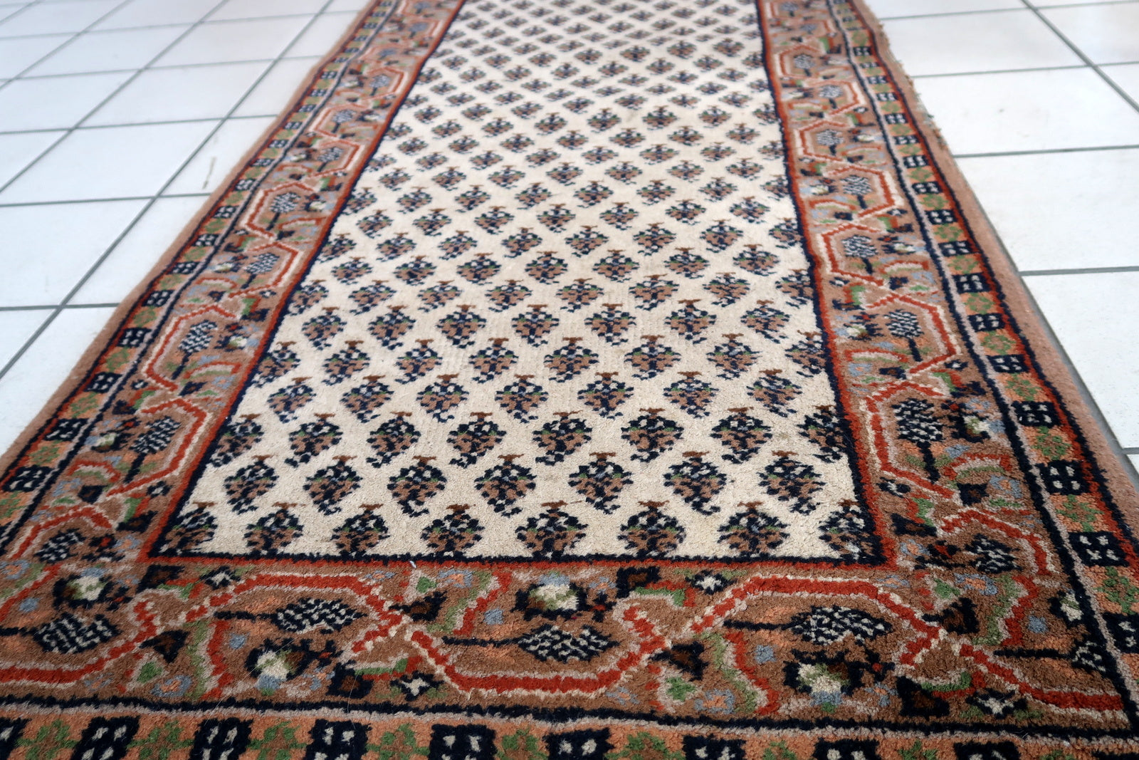 Handmade vintage Indian Seraband rug in white color and all-over design. The rug has been made in the end of 20th century. It is in original good condition.
