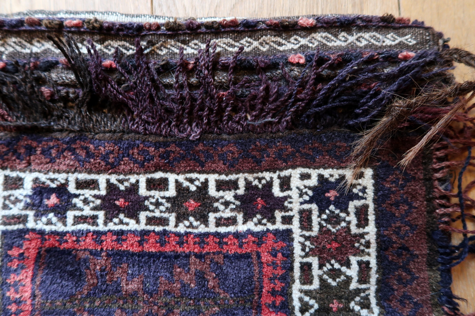Handmade semi-antique Afghan Baluch salt bag in purple and white colors and stars design. The bag is from the beginning of 20th century in original good condition.