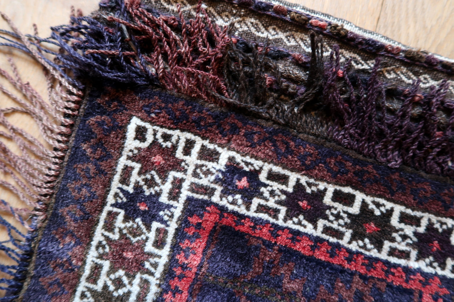 Handmade semi-antique Afghan Baluch salt bag in purple and white colors and stars design. The bag is from the beginning of 20th century in original good condition.