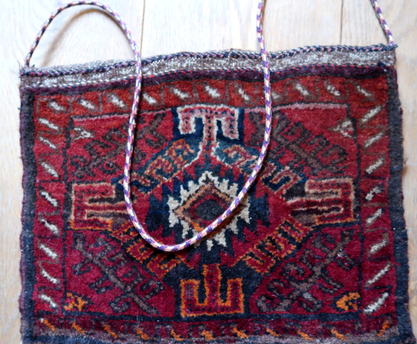 Handmade vintage Uzbek Salt bag in red color and large medallion. The bag is from the end of 20th century in original good condition. The handle has been attached to it, it can be removed or used as a regular handbag.