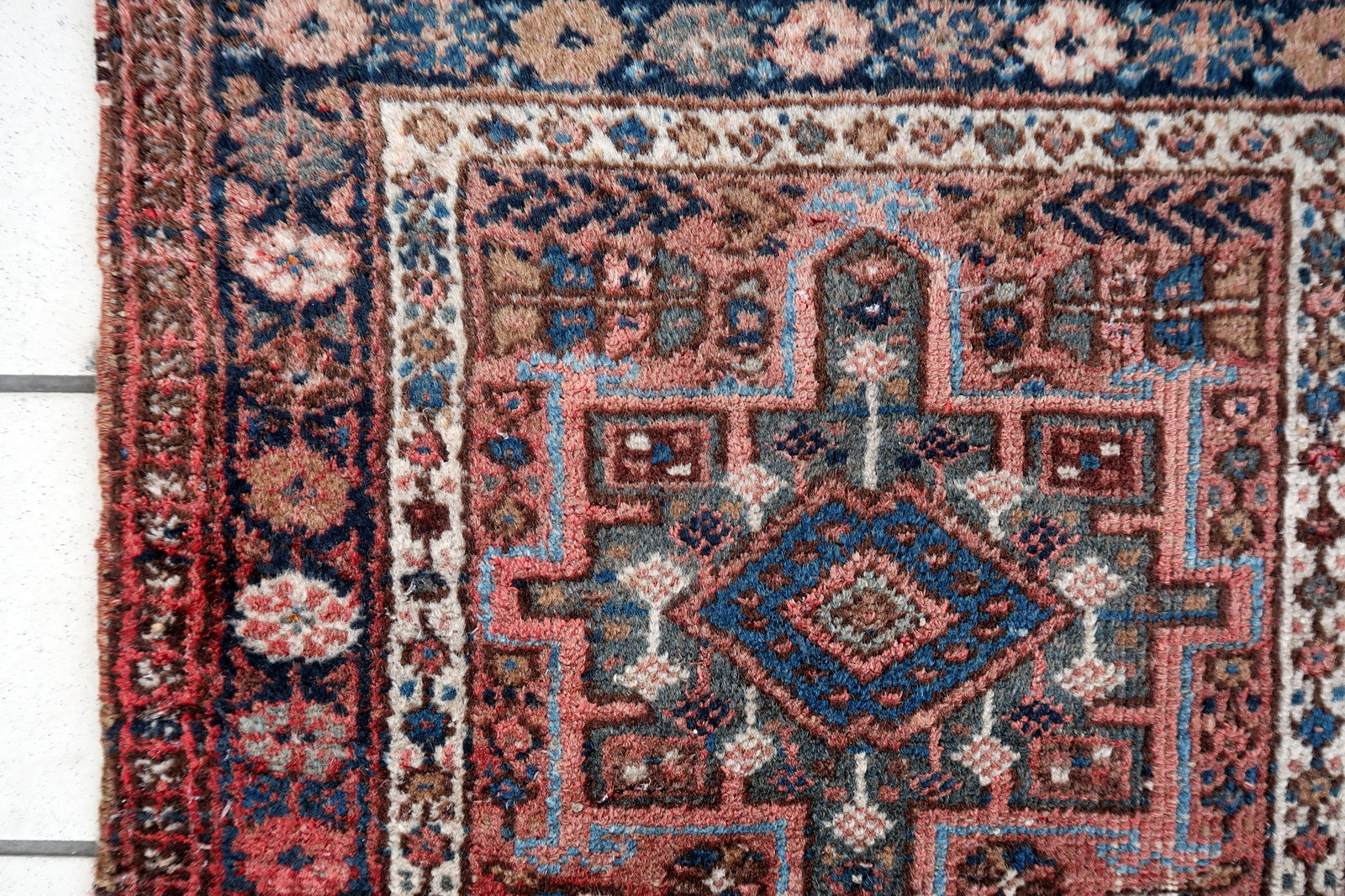 Handmade vintage Karajeh rug in traditional triple medallion design. The rug is in pale red color. It is from the end of 20th century in original good condition.
