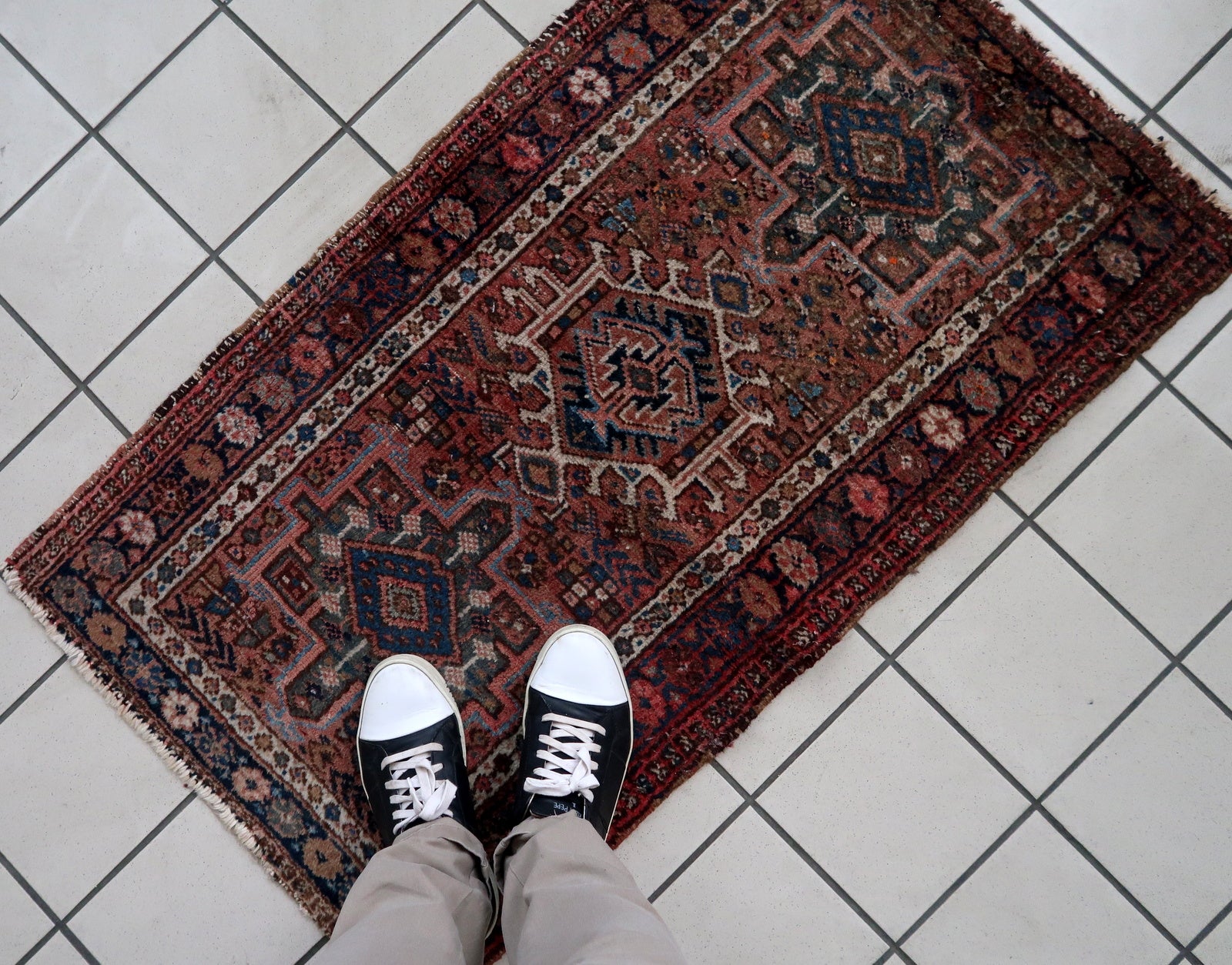 Handmade vintage Karajeh rug in traditional triple medallion design. The rug is in pale red color. It is from the end of 20th century in original good condition.