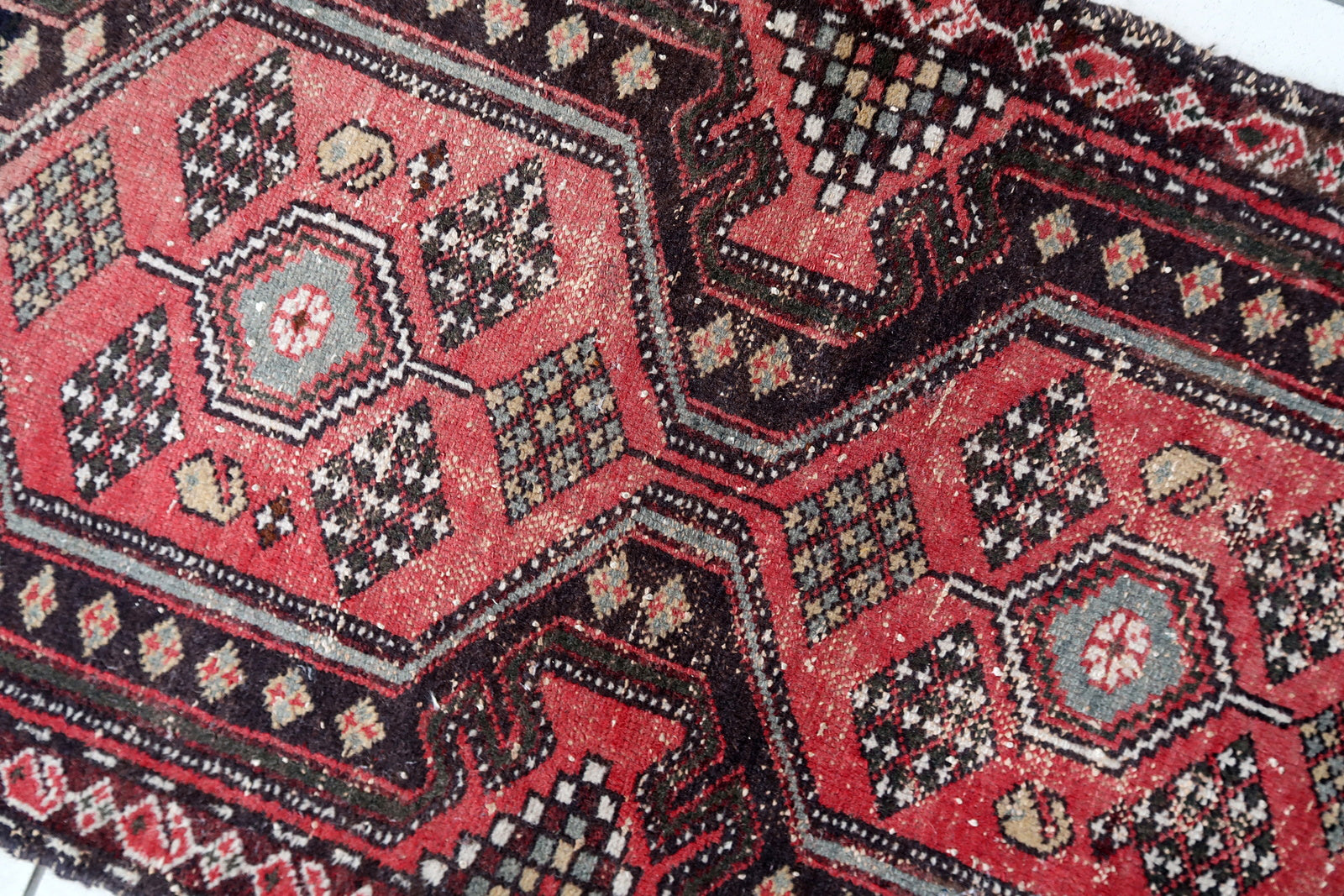 Handmade vintage Persian Hamadan rug in pale red and brown colors. The rug is from the middle of 20th century in original condition, it has some signs of age.