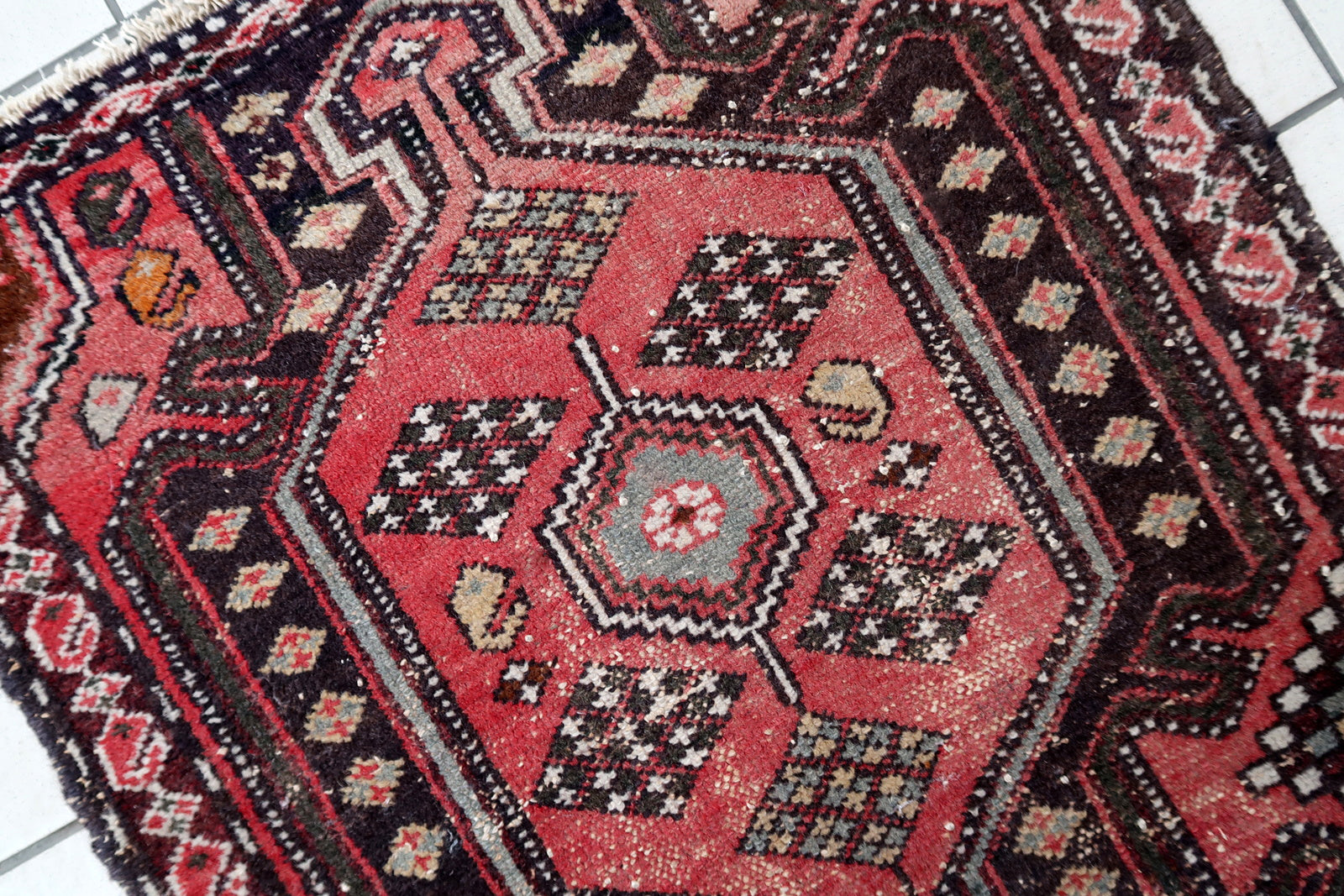 Handmade vintage Persian Hamadan rug in pale red and brown colors. The rug is from the middle of 20th century in original condition, it has some signs of age.
