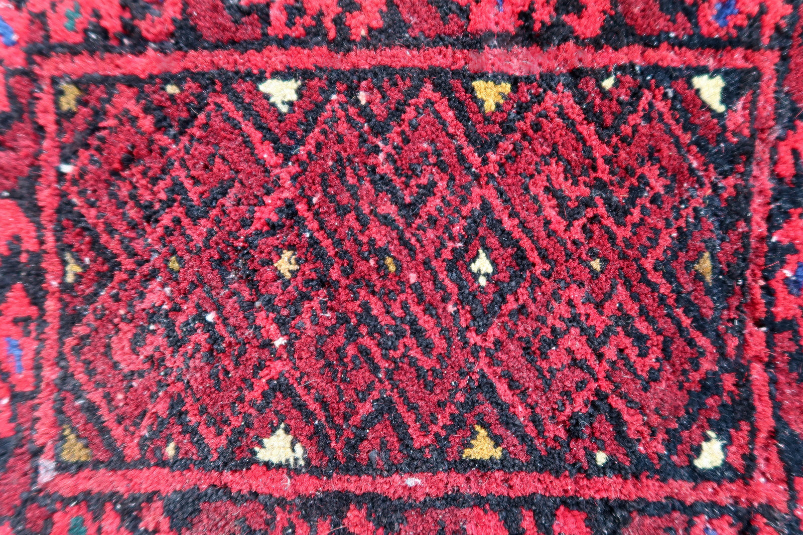 Handmade vintage Afghan Ersari mat in bright red shade. The rug is from the end of 20th century in original good condition. It can be used as a doll house rug.