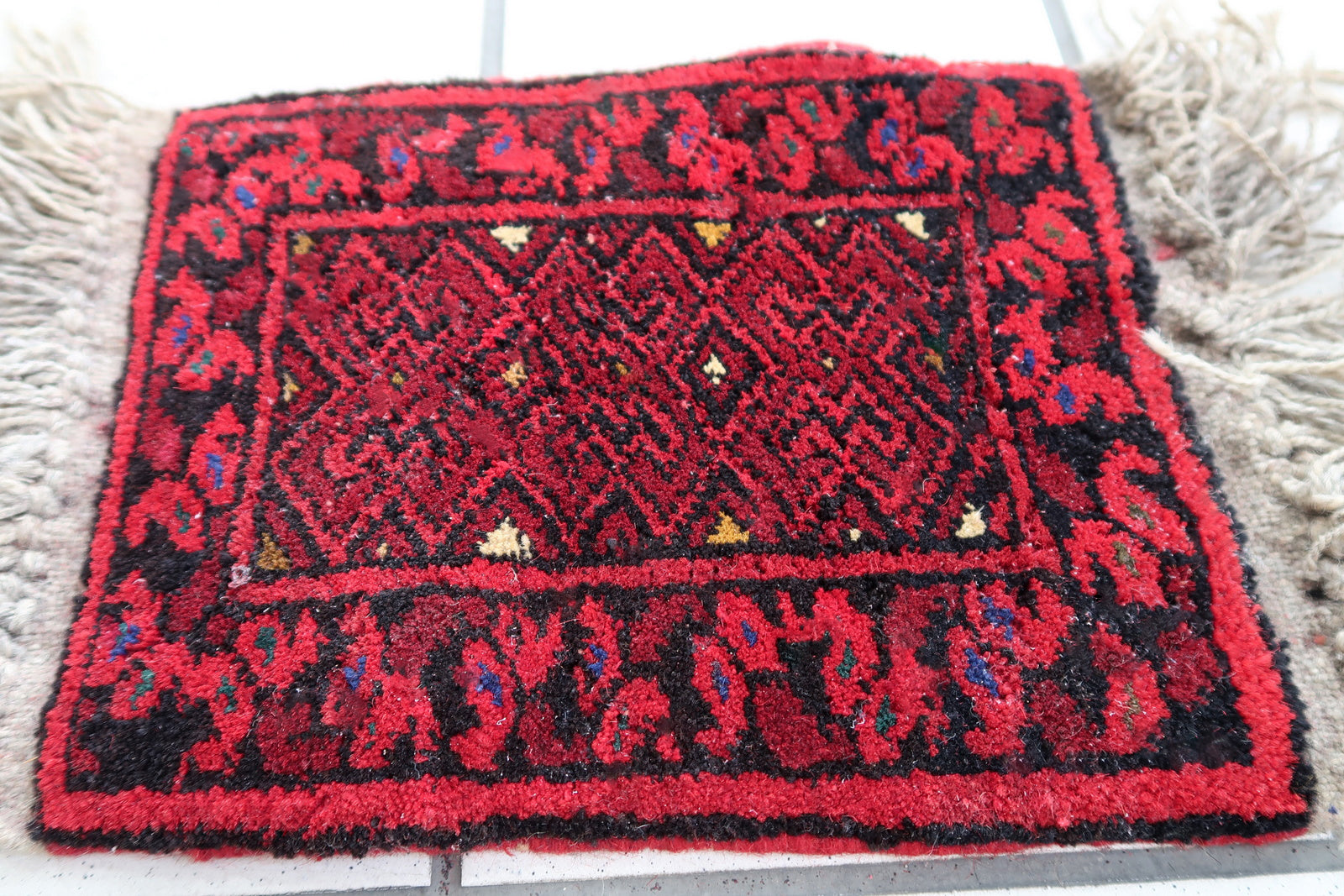 Handmade vintage Afghan Ersari mat in bright red shade. The rug is from the end of 20th century in original good condition. It can be used as a doll house rug.
