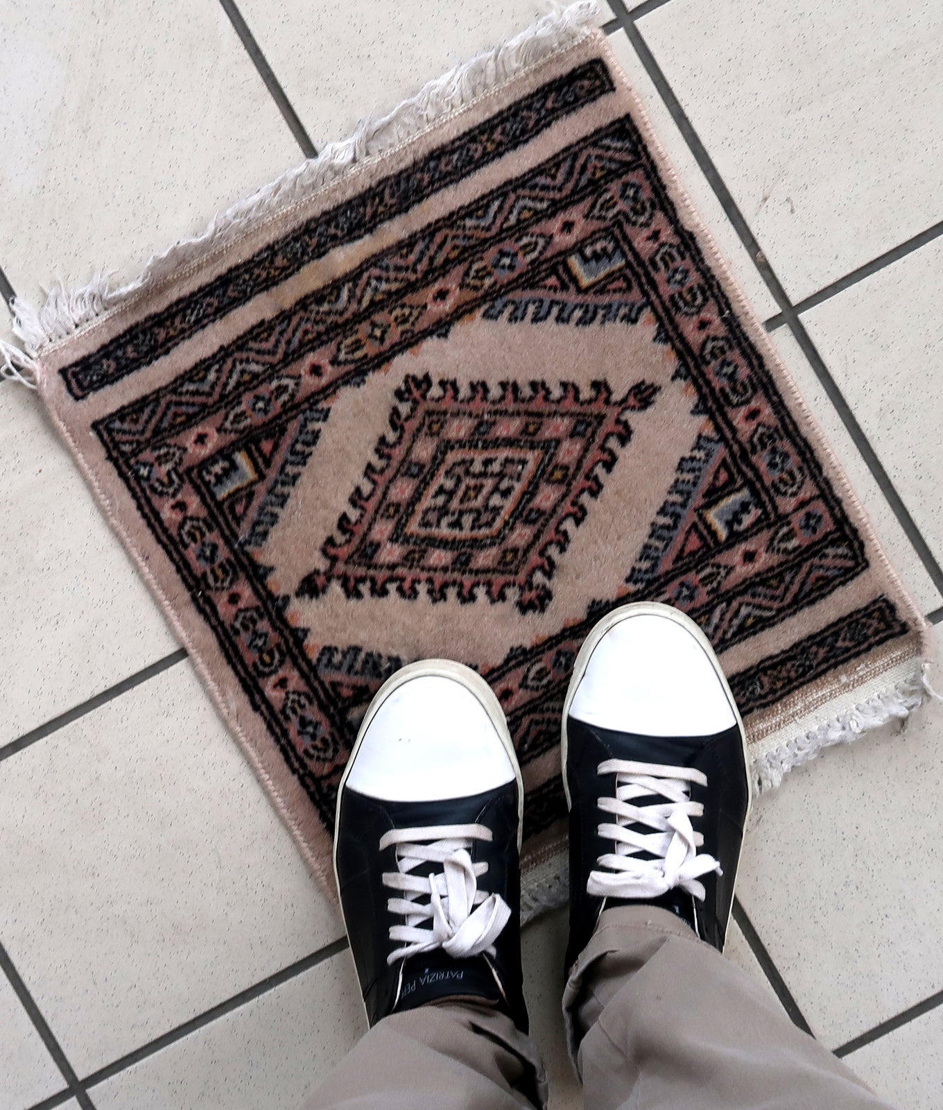 Handmade vintage Uzbek Bukhara rug in traditional design. The rug is from the end of 20th century in original good condition.