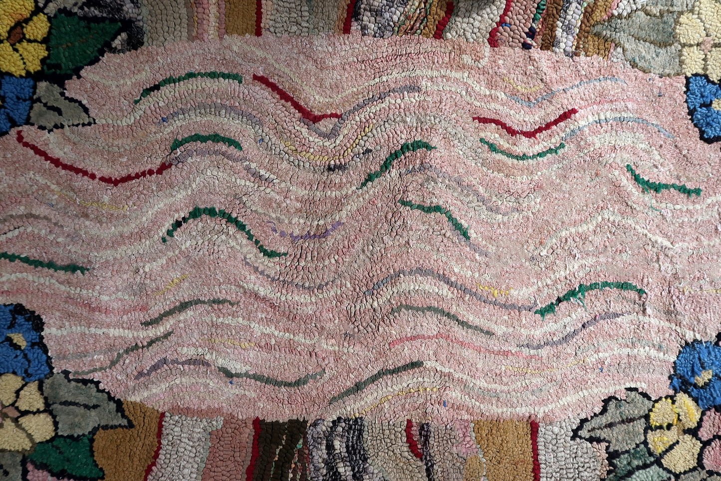 Handmade antique American Hooked rug in abstract design. The rug is from the end of 19th century. It is in good condition, has some old restorations.