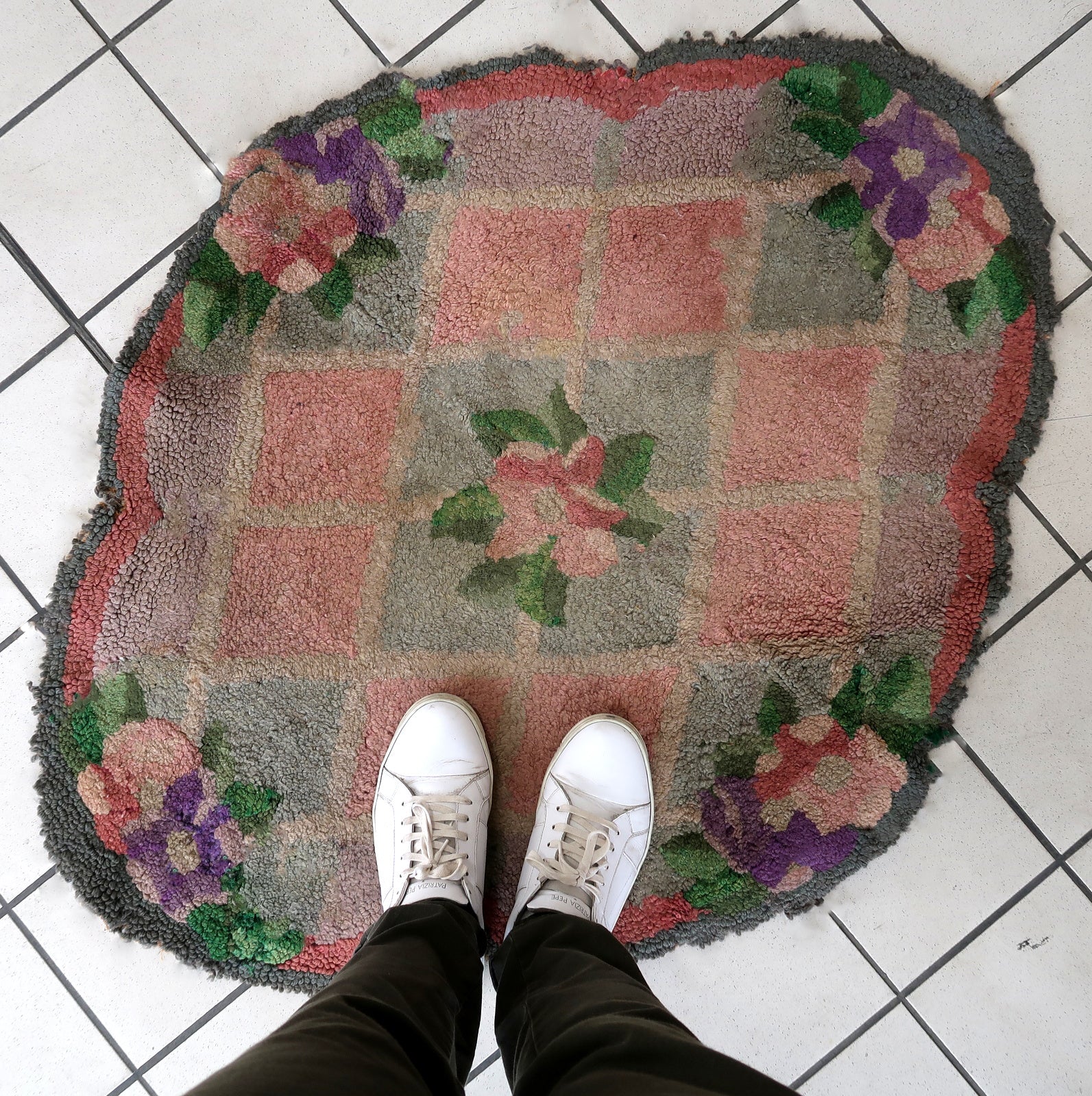 Handmade vintage American Hooked rug in unusual design and pastel shades. The rug is from the end of 20th century. It has some old restorations.