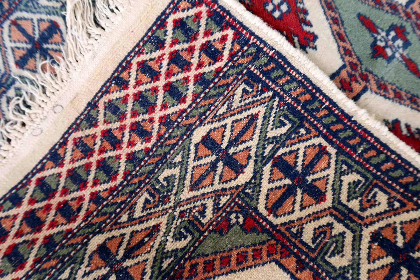 Handmade vintage Bukhara rug in unusual colors. The rug is in original good condition, it is from the end of 20th century.