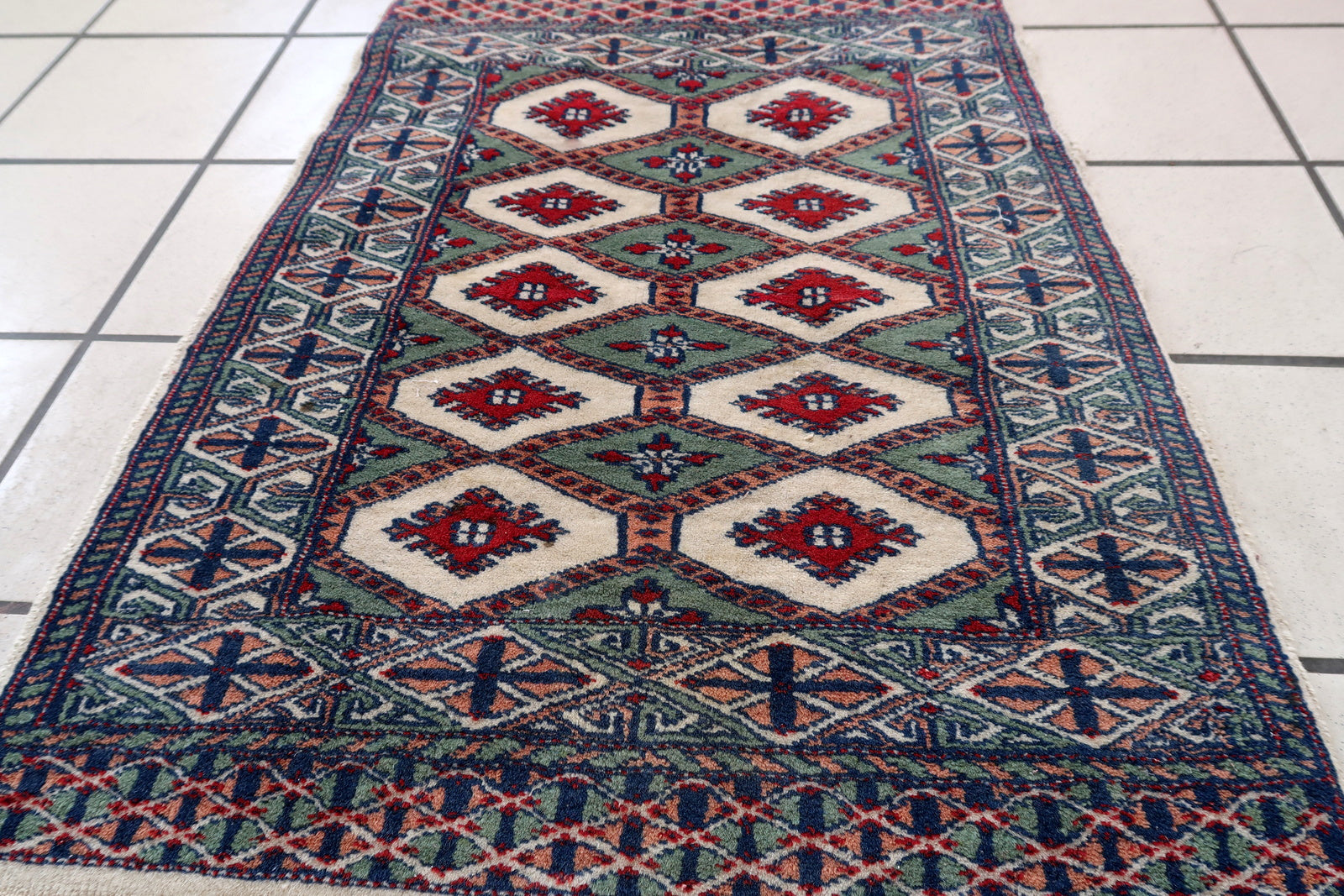 Handmade vintage Bukhara rug in unusual colors. The rug is in original good condition, it is from the end of 20th century.