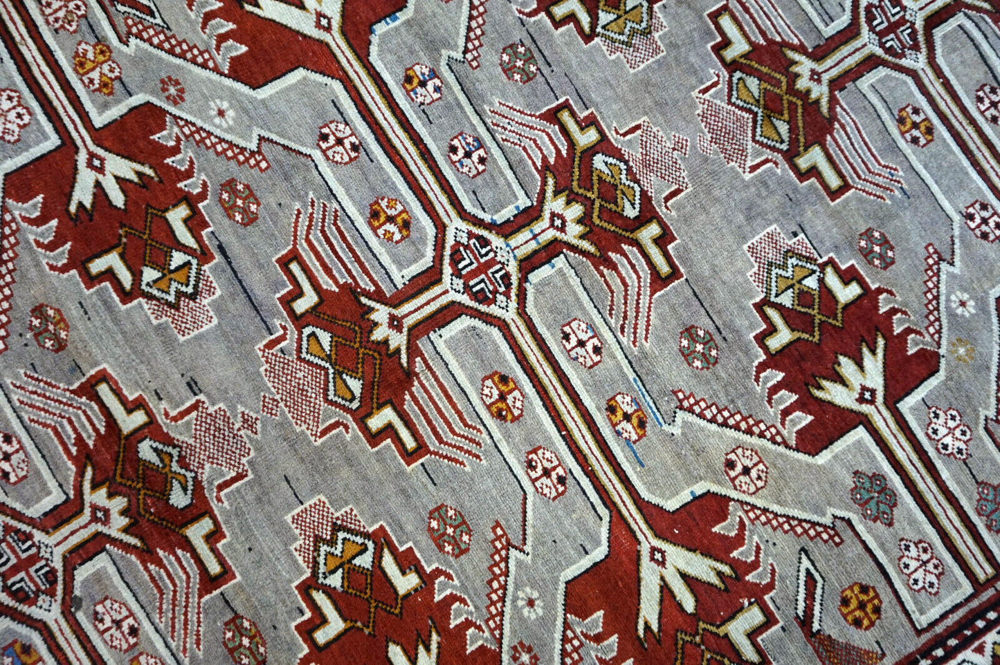 Handmade vintage Caucasian Shirvan rug in unusual cross design. The rug is from the middle of 20th century in original good condition.