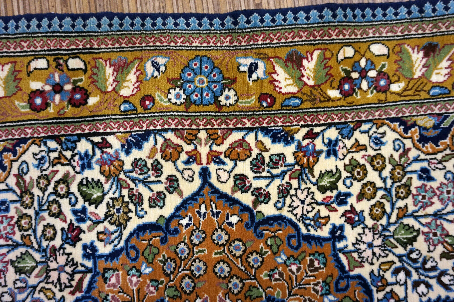 Handmade vintage Persian Qum rug in traditional medallion design. The rug is from the end of 20th century in original good condition.
