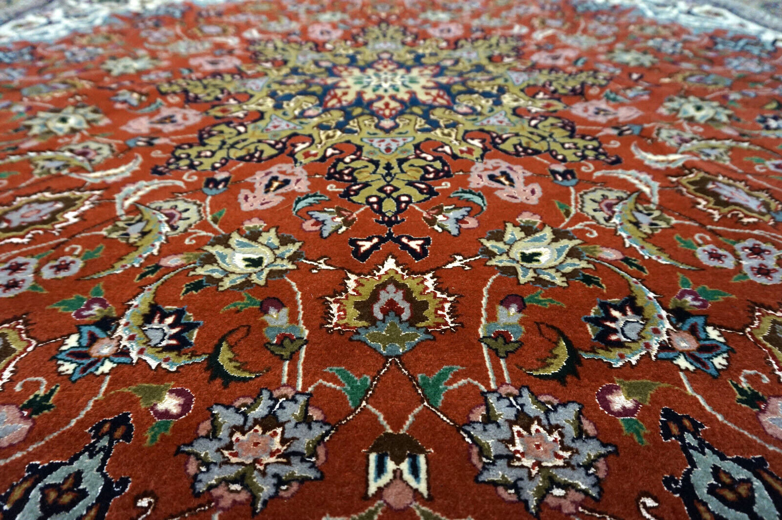Handmade vintage Persian Tabriz square rug in classic floral design. The rug is fro;m the end of 20th century in original good condition. 