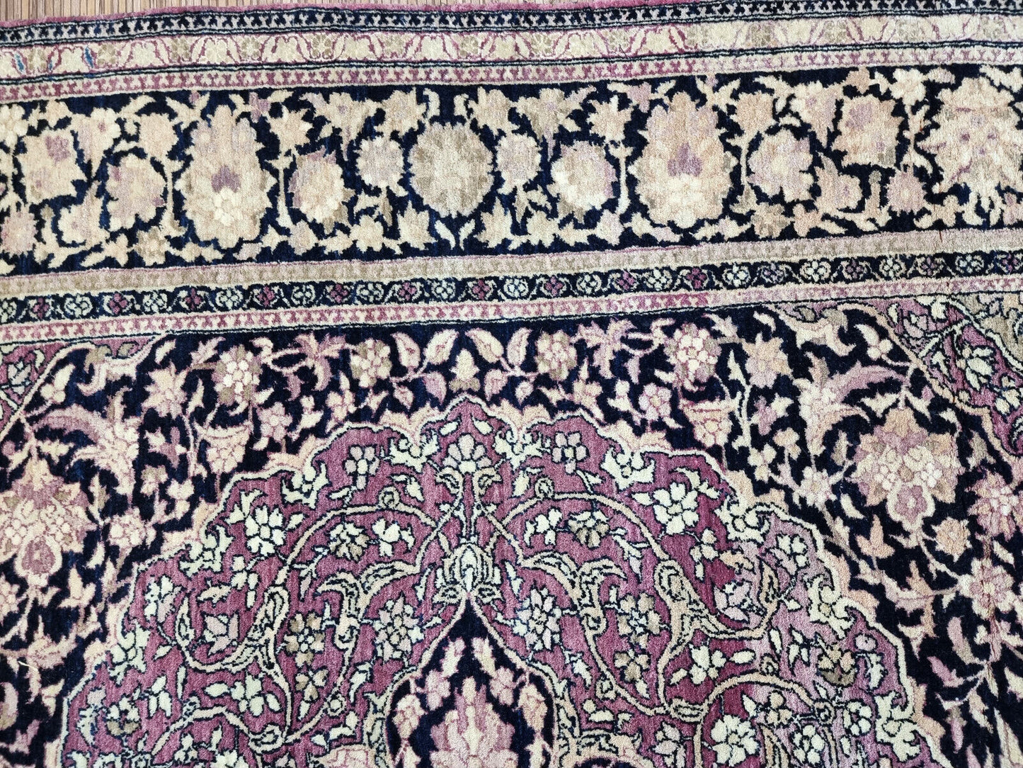 Handmade antiaue Persian Isfahan rug in traditional floral design with large medalllioin. The rug is from the beginning of 20th century in original good condition. It is made in wool.
