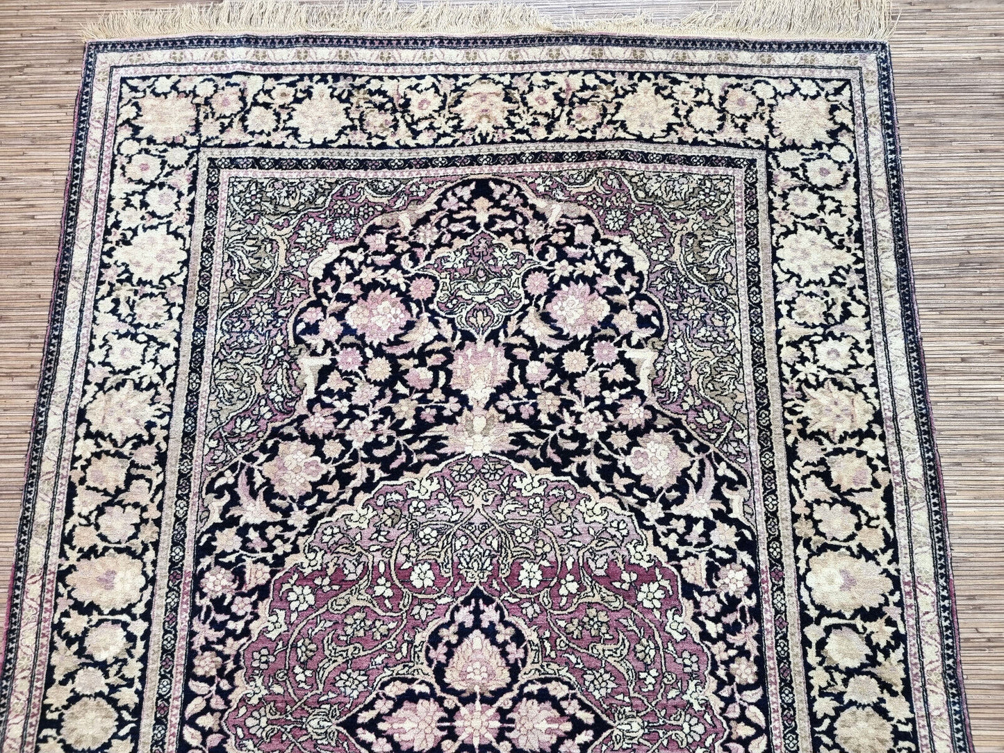 Handmade antiaue Persian Isfahan rug in traditional floral design with large medalllioin. The rug is from the beginning of 20th century in original good condition. It is made in wool.