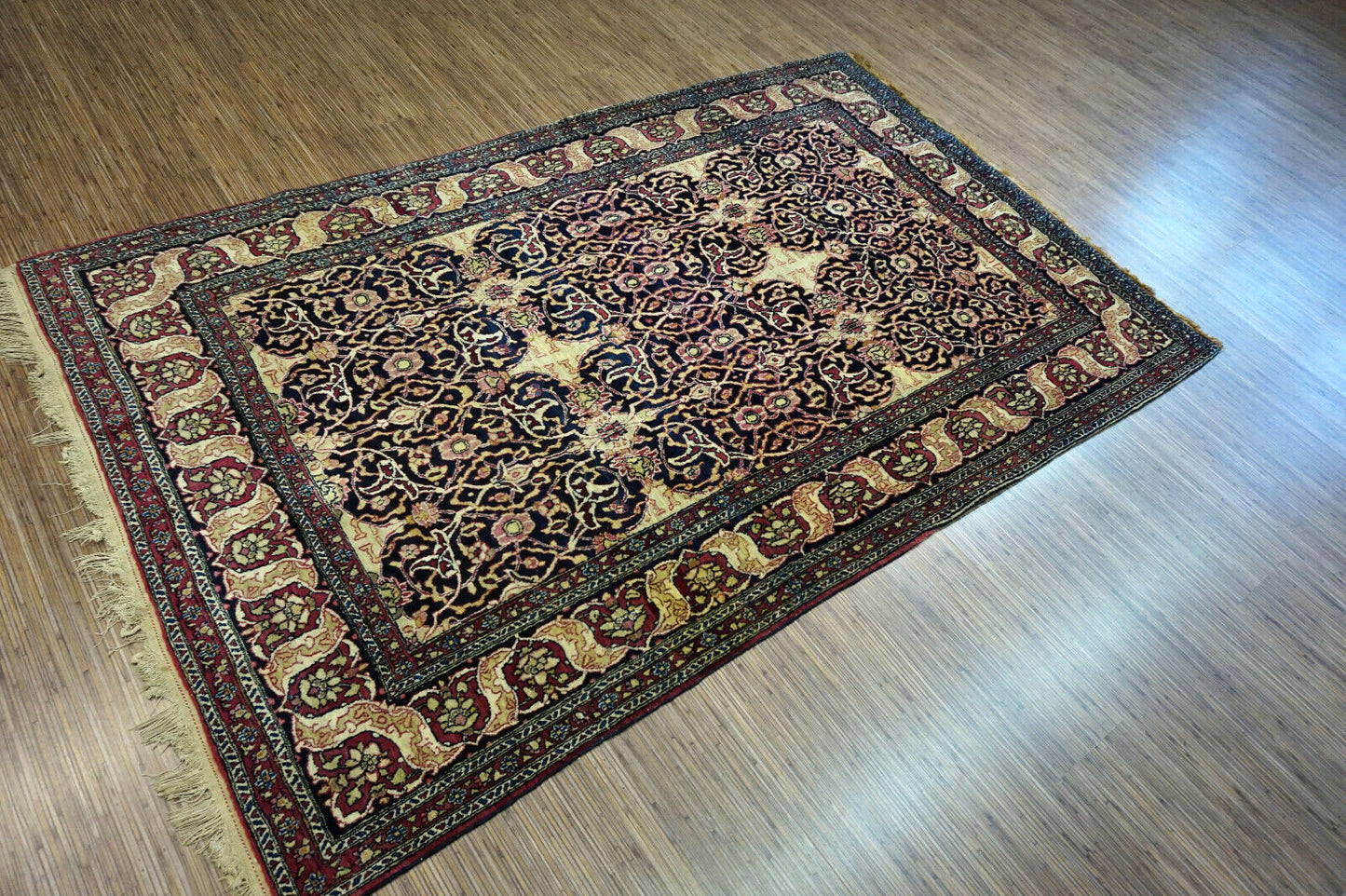 Handmade antique Persian Isfahan rug 1900s
