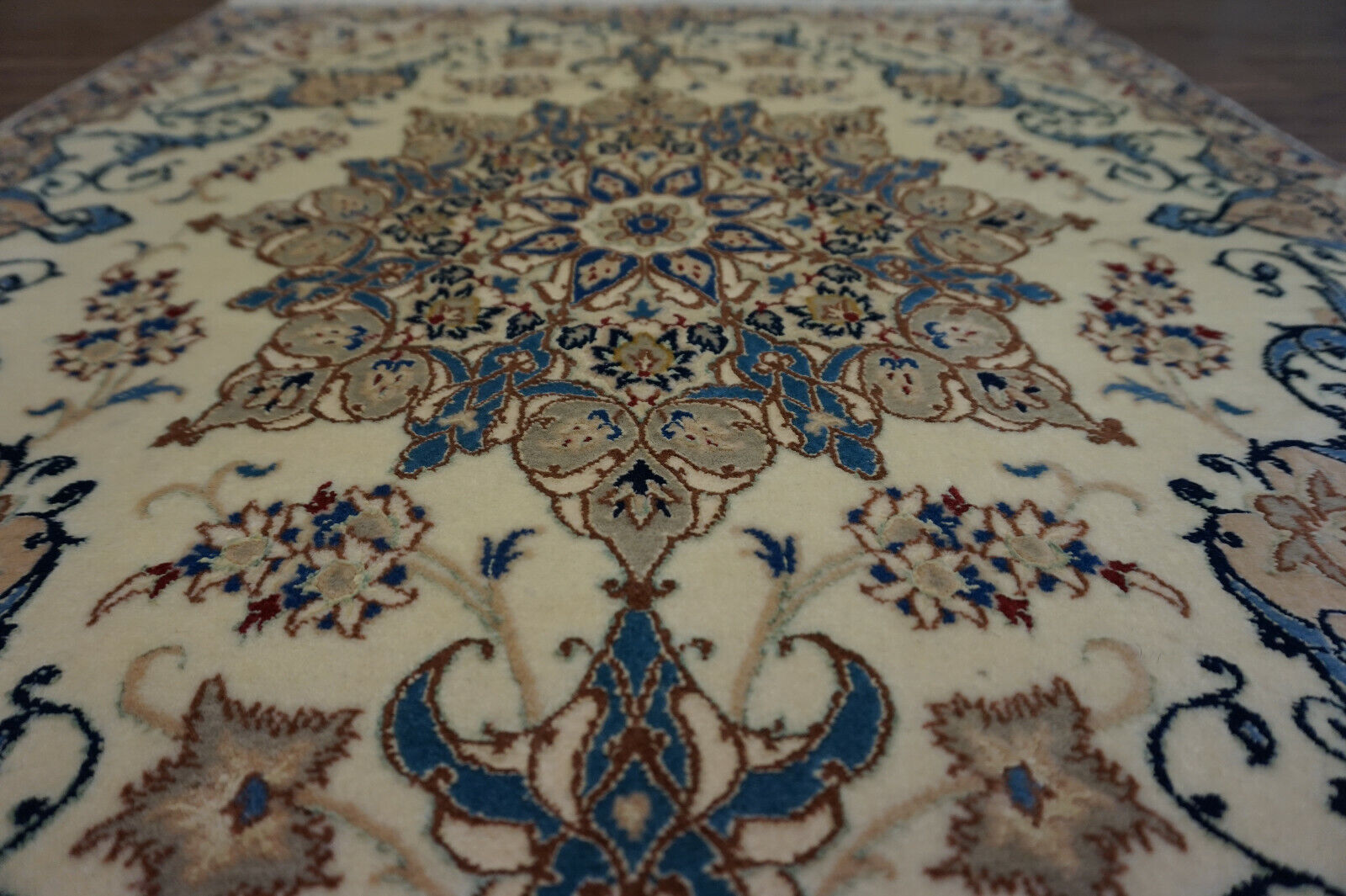 Handmade vintage Persian Nain rug in classic design and beige and blue shades. The rug is from the end of 20th century in original good condition. 