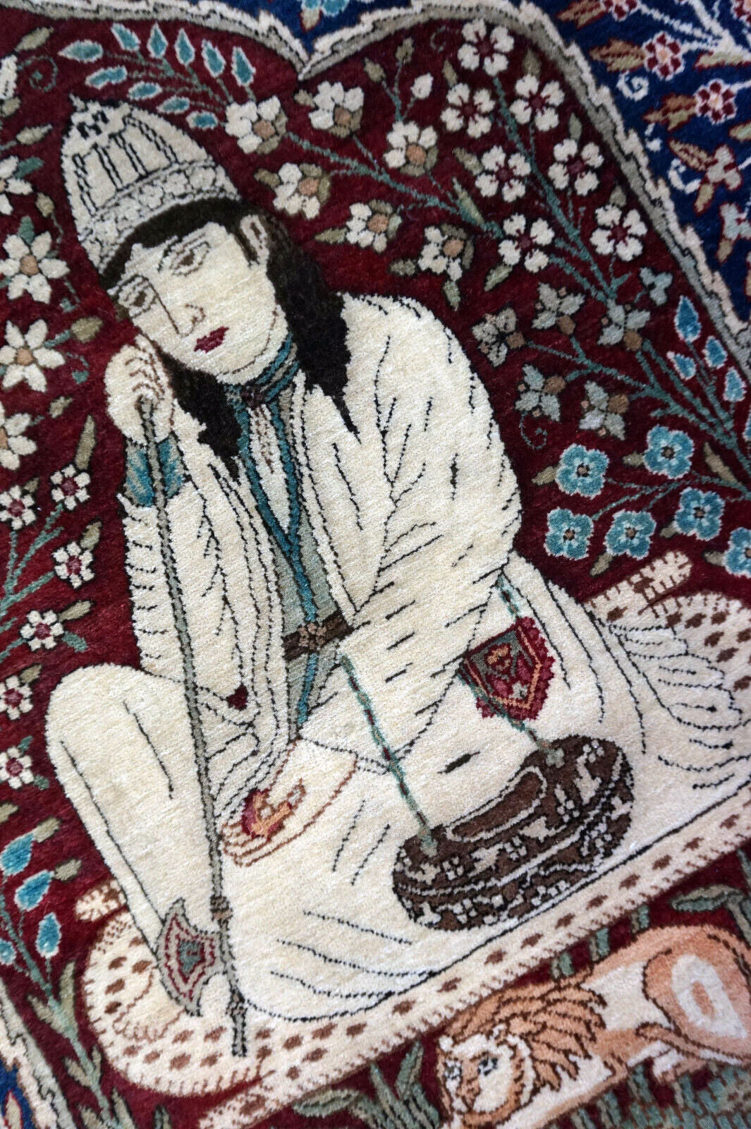Handmade antique Persian Kerman Lavar rug with pictorial dsign. The rug is from the begining of 20th century in original good condition.