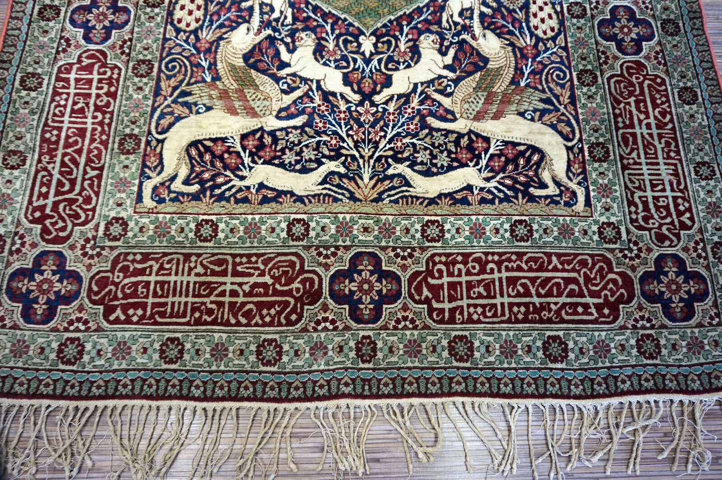 Handmade antique Persian Kerman Lavar rug with pictorial dsign. The rug is from the begining of 20th century in original good condition.