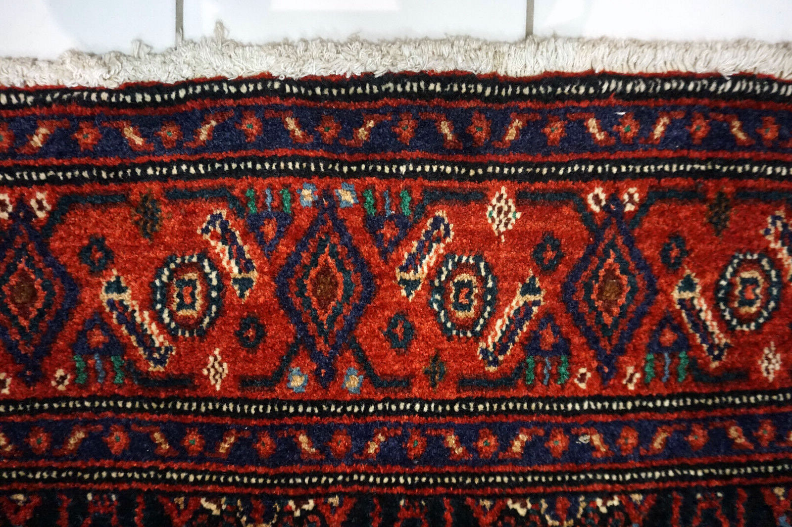 Handmade vintage Persian Senneh rug in kele size and traditional design. The rug is from the end of 20th century in original good condition.