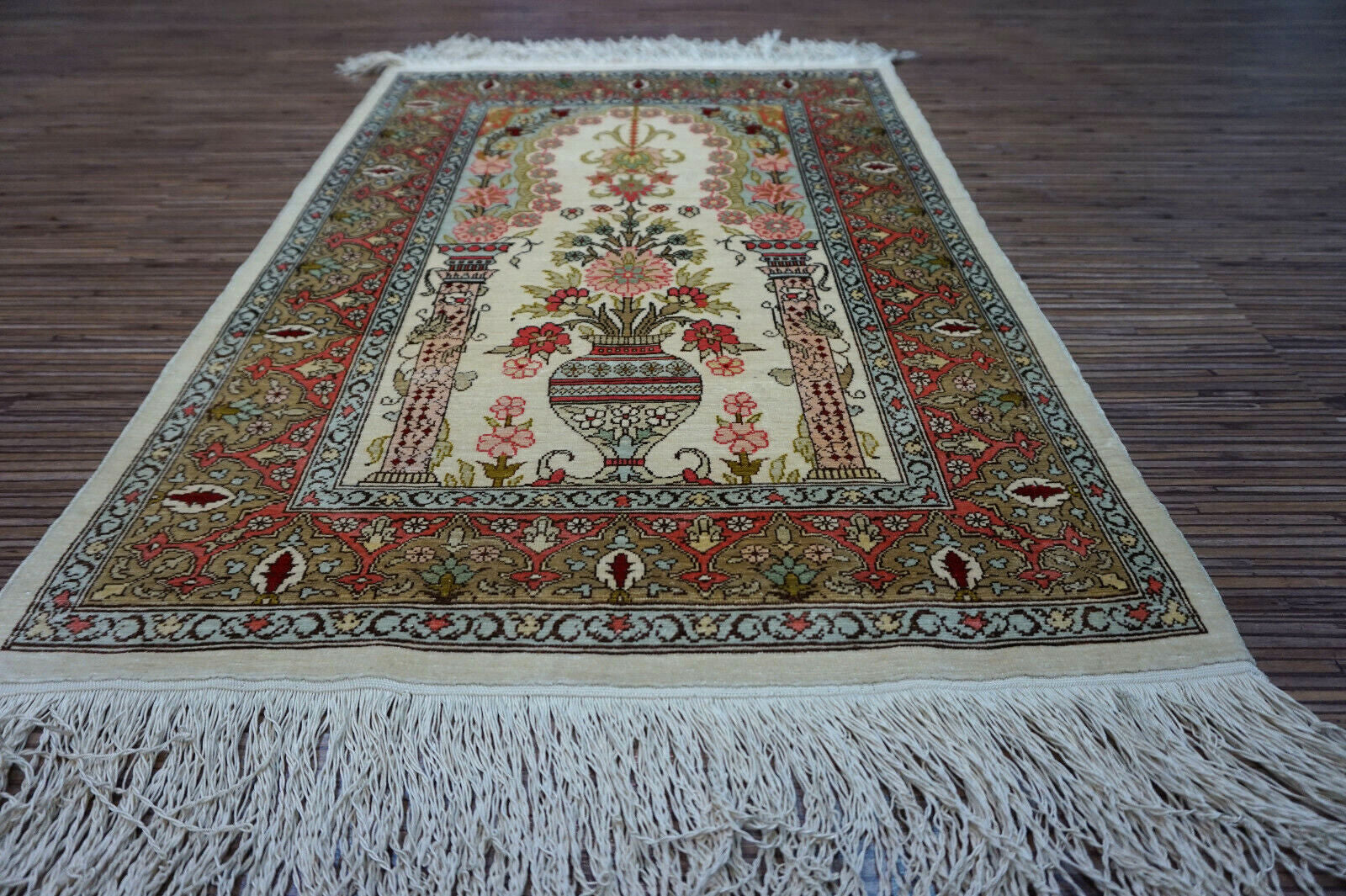 Hereke Silk Rug with beige, rose, olive green, and red prayer design