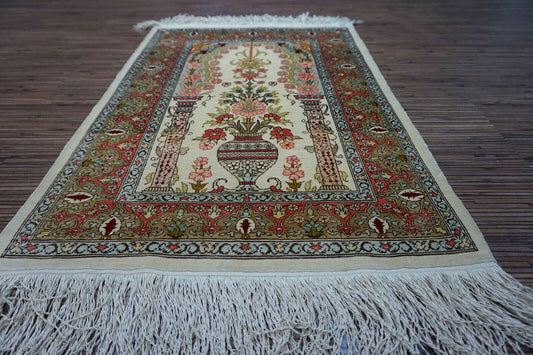 Hereke Silk Rug with beige, rose, olive green, and red prayer design