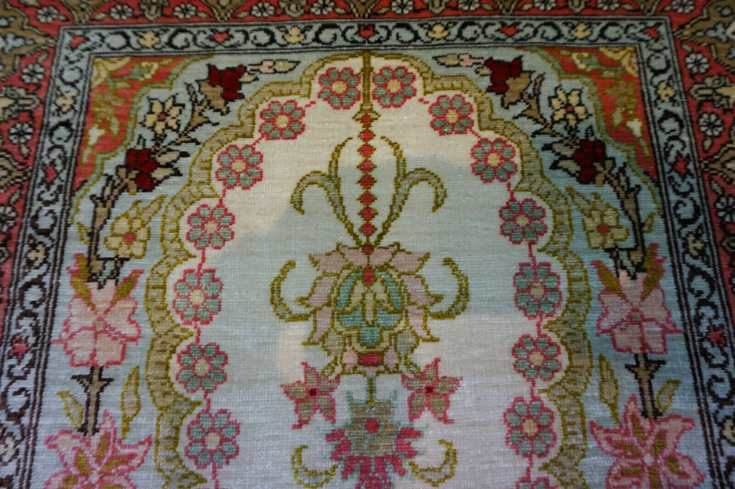 Intricate silk weave of Hereke Rug