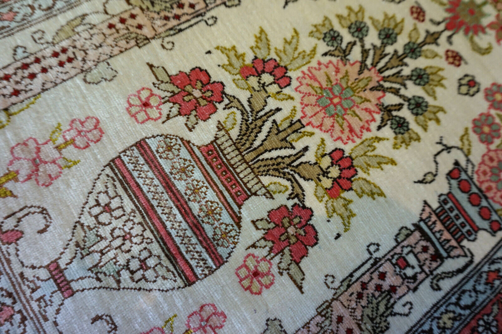 Rose and olive green details on Hereke Silk Rug