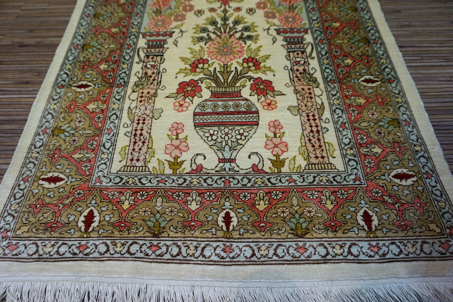 Beige and red accents on Turkish Hereke Silk Rug