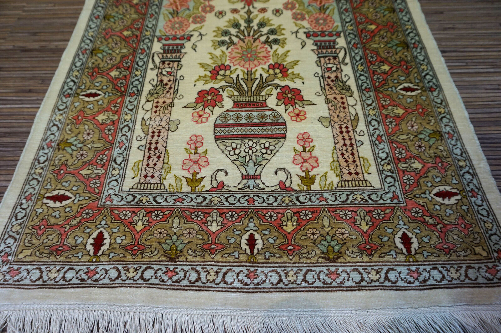 Beige and red accents on Turkish Hereke Silk Rug