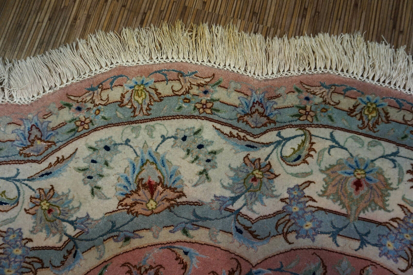 Beige, Pink, and Turquoise Details on Wool Rug
