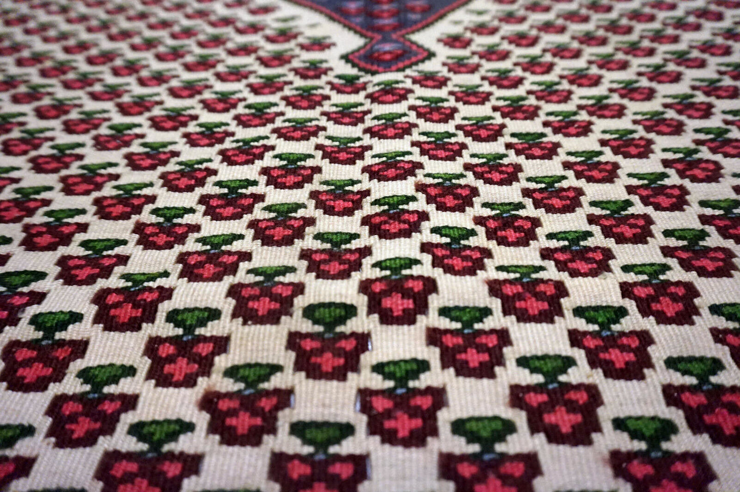 Detailed image showcasing the woolen texture and fine details of the rug