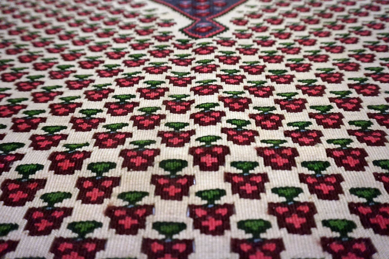 Detailed image showcasing the woolen texture and fine details of the rug