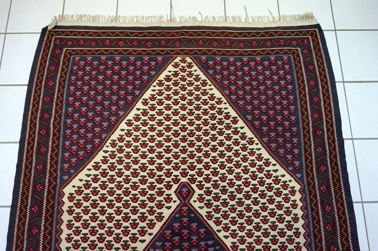 Close-up of intricate Senneh style pattern on vintage kilim