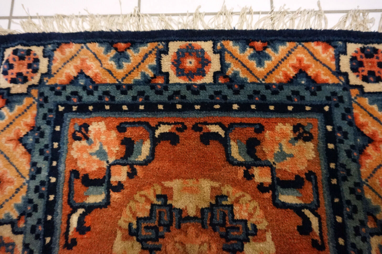 Detail of Ningsha Rug's Beige, Red, and Blue Hues - Chinese Cultural Heritage Piece