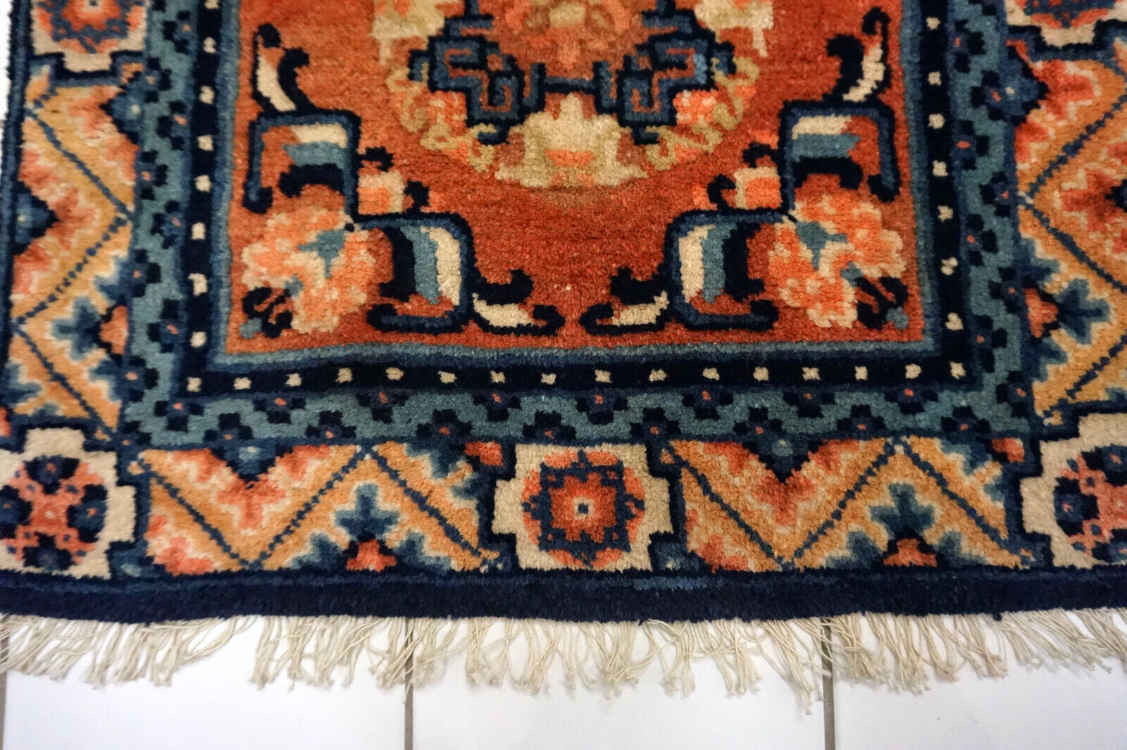 Detail of Ningsha Rug's Beige, Red, and Blue Hues - Chinese Cultural Heritage Piece