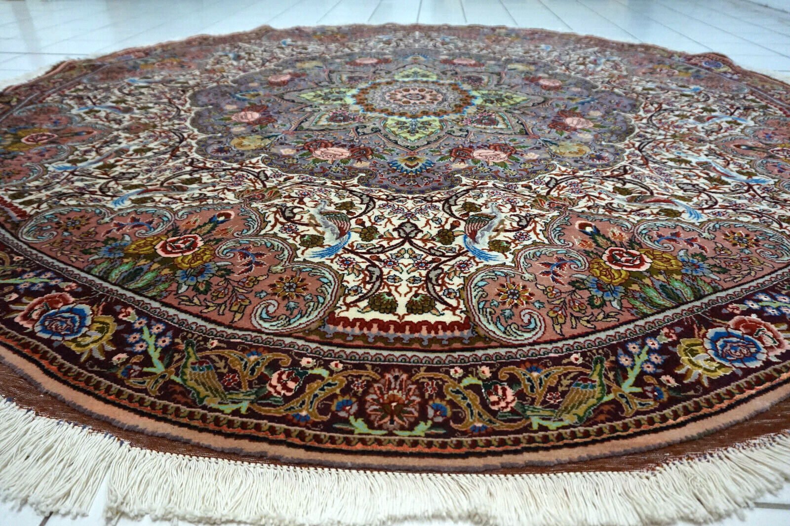 Intricate floral design of Tabriz rug
