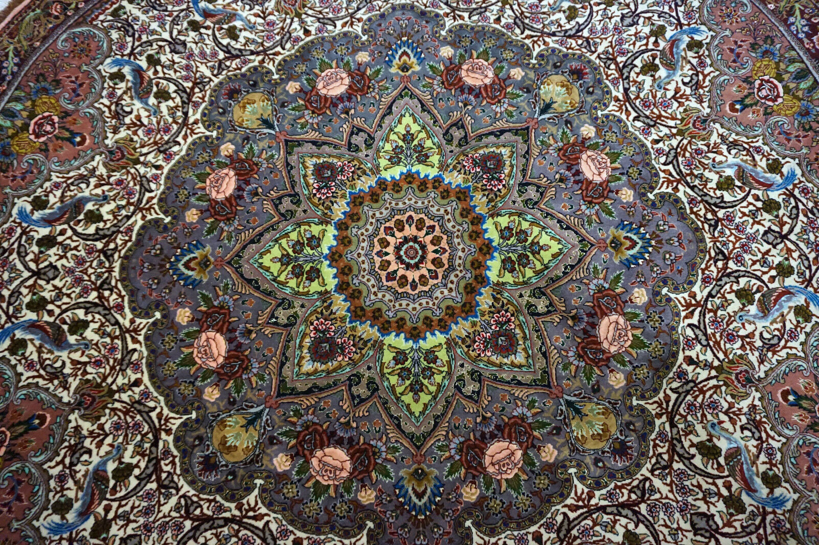 Detailed view of handmade Tabriz rug