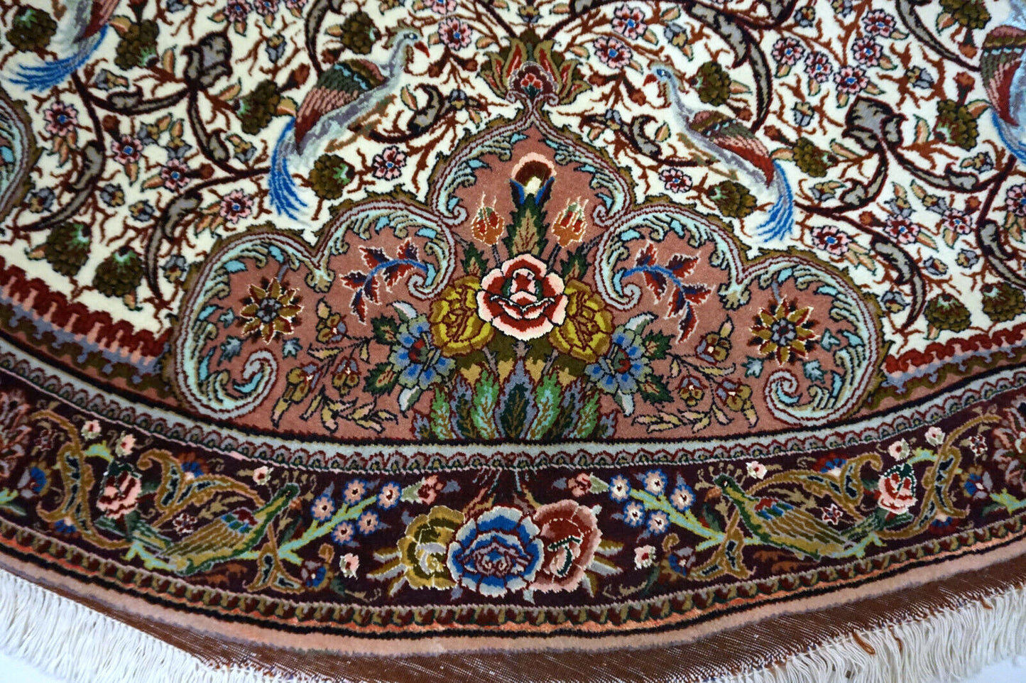 Silk highlights on Tabriz rug