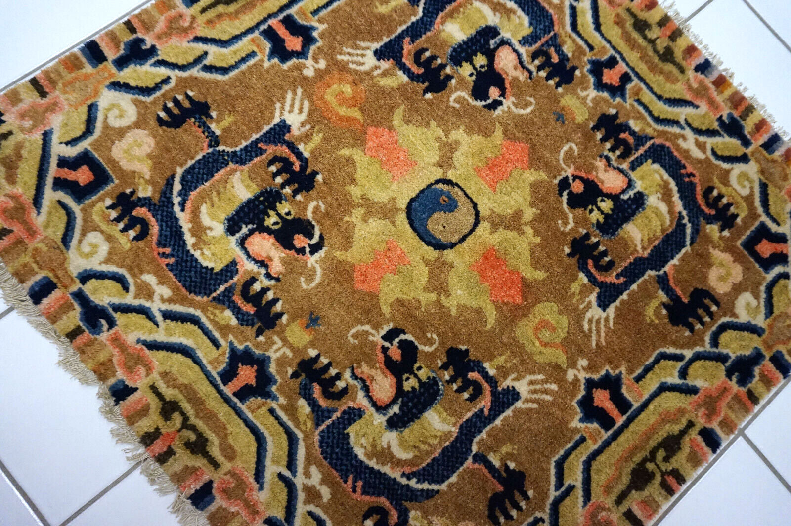 Antique wool rug with historic Chinese design