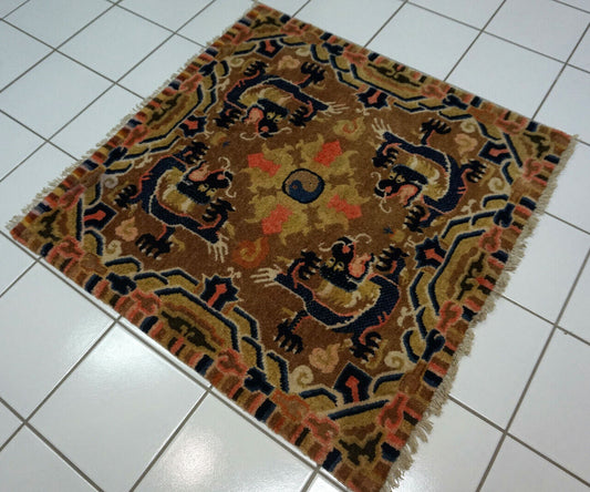 Antique Chinese rug with dragon design