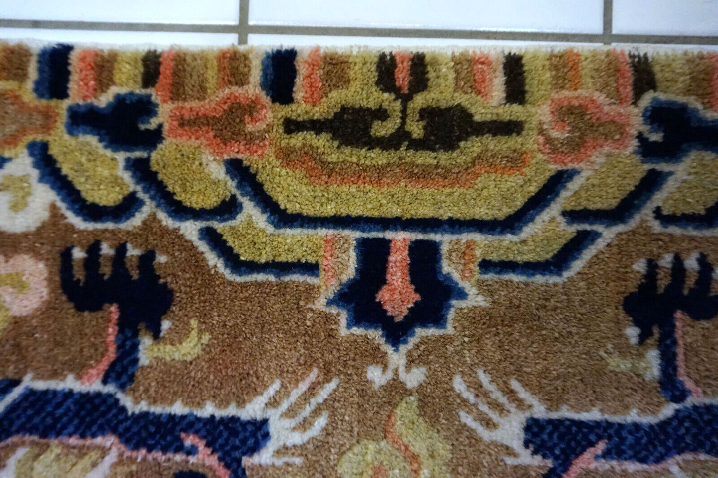 Detailed shot of yellow medallion on vintage Ningsha rug