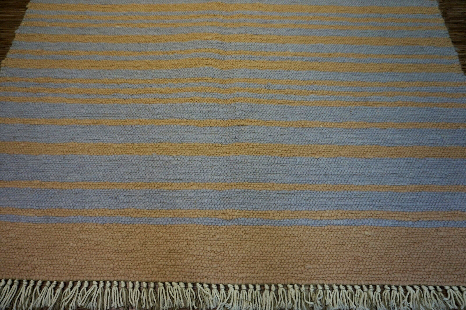 Grey and yellow striped rug