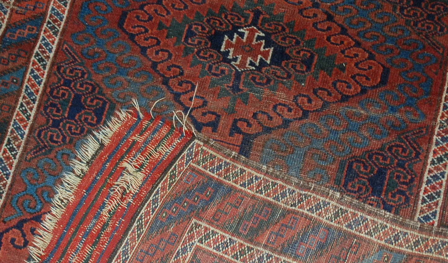 Hand made antique collectible Afghan Baluch rug in original condition, it has some low pile. The rug is from the beginning of 20th century.