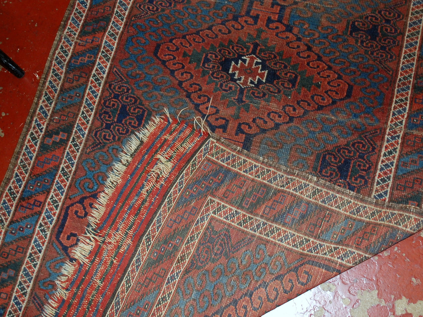 Hand made antique collectible Afghan Baluch rug in original condition, it has some low pile. The rug is from the beginning of 20th century.